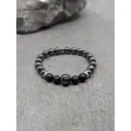 Bracelet en bois fossilisé, agate noire 8mm et perle de tahiti gravée